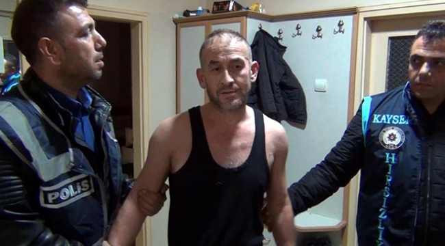 Polis evini basınca kapının arkasına saklandı