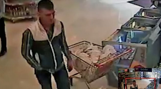 Hırsız iki kilo kaşarı montunun altına saklayarak çaldı